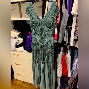 Ankle length long formal gown, never worn. Size 14